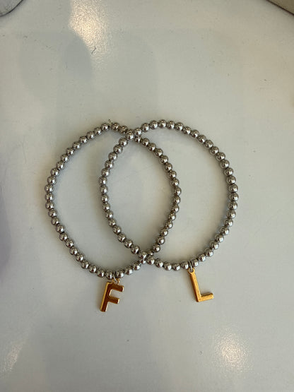 Pulsera inicial bicolor