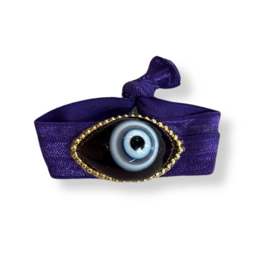 Pulsera tela morada ojo negro